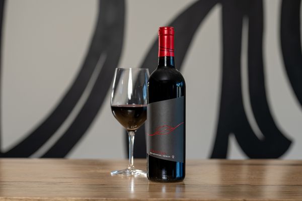 Photo of Page Cellars - Woodinville, WA, US. a bottle of wine and a glass of wine