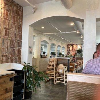 NU Kitchen - a man sitting at a table in a restaurant - Juice Bars & Smoothies Near Me - Newburyport, Massachusetts NU Kitchen - a man sitting at a table in a restaurant - Juice Bars & Smoothies Near Me - Newburyport, Massachusetts