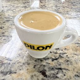 a cup of coffee on a table