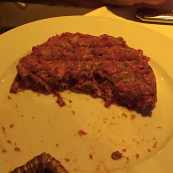 La Rotonde - The AMAZING AMAZING steak tartare, shown here half gone, tasted of mustard and capers and sauteed onion bits... - Brasseries Near Me - Paris, 75