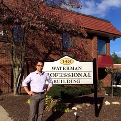 Traditional Eastern Medicine - Dr. Lee in front of the office