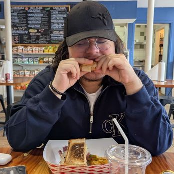 Otherside Deli and Sub - My son having a Reuben for the first time and he is looking like oh my. - Delis Near Me - Austin, Texas