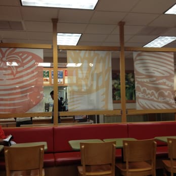 Wendy's - a woman sitting at a table in a restaurant - Burgers Near Me - Philadelphia, Pennsylvania Wendy's - a woman sitting at a table in a restaurant - Burgers Near Me - Philadelphia, Pennsylvania