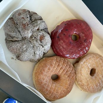 Oliboli Donuts - One Cardamom Bun, a bambleberry (I think), a cinnamon sugar, and a plain glazed classic donut. - Donuts Near Me - Tustin, California