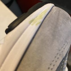 Wilkins Shoecenter - This is a grass stain (From wearing them) from whoever brought them back for bad lines.