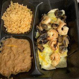 Spinach enchiladas topped with shrimp & mushrooms Spinach enchiladas topped with shrimp & mushrooms