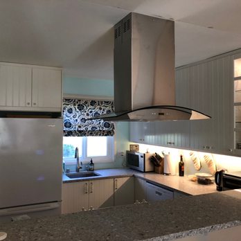 D Light Construction - a kitchen with granite counter tops - General Contractors Near Me
