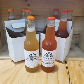 Wave Brewing Company - bottles of beverage on a table - Kombucha Near Me - Steamboat Springs, Colorado Wave Brewing Company - bottles of beverage on a table - Kombucha Near Me - Steamboat Springs, Colorado