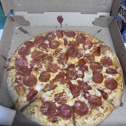 Large double pep with garlic sauce on the lower left side of the box. Large double pep with garlic sauce on the lower left side of the box.