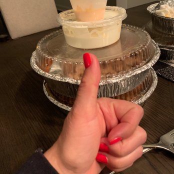 Mesquito Grille - a person's finger pointing at a pie - Barbeque Near Me - Doylestown, Pennsylvania