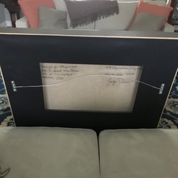 Masterpiece the Art of Framing - Plastic window on the back of a frame so you can read the painter's hand written note