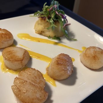 Dockside Bistro & Wine Bar - The scallops in saffron cream. Very good, but rich. - New American Near Me - Olympia, Washington