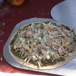 Copper Top Ovens - pizza with pesto, oyster mushrooms, bleu cheese, ready to go into the oven