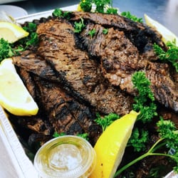 Nicoya Nicaragüan Grill - Freshly grilled Carne Asada served with Chimichurri and Lemon