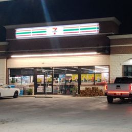 Exterior outside entrance of 7-Eleven - Front of 711 from the gas pumps - Grand Prairie, Texas Exterior outside entrance of 7-Eleven - Front of 711 from the gas pumps - Grand Prairie, Texas