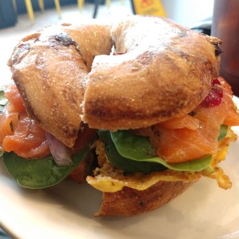 Lakou Cafe - Egg, smoke salmon, cheese, and onion confit on a cinnamon raisin bagel - Vegan Near Me - Brooklyn, New York Lakou Cafe - Egg, smoke salmon, cheese, and onion confit on a cinnamon raisin bagel - Vegan Near Me - Brooklyn, New York