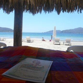Arena Reataurant - Table under a palapa - Cocktail Bars Near Me - Zihuatanejo, GRO Arena Reataurant - Table under a palapa - Cocktail Bars Near Me - Zihuatanejo, GRO