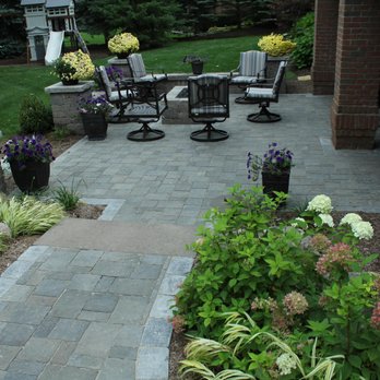 Munaco Landscape - a brick patio with chairs and tables - Landscape Architects or Designers Near Me - Utica, Michigan