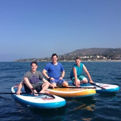 Sunset Stand Up Paddle - Boys taking a break.
