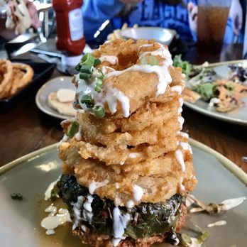 Front Porch - Pork turnip green stack with grit cake on bottom. - Bars Near Me - Hoover, Alabama Front Porch - Pork turnip green stack with grit cake on bottom. - Bars Near Me - Hoover, Alabama