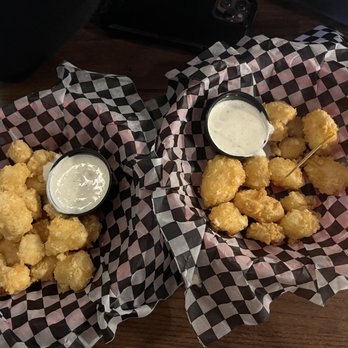 The Tipsy Cow - Cheese curds (left), goat cheese curds (right) - Bars Near Me - Madison, Wisconsin The Tipsy Cow - Cheese curds (left), goat cheese curds (right) - Bars Near Me - Madison, Wisconsin