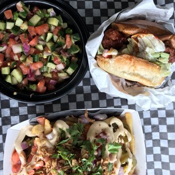 Rick's Good Eats - Loaded fries with butter chicken, kachumber salad, and the RFC burger - Indian Near Me - Mississauga, Ontario