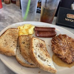 Beef sausage, rye toast, one scrambled egg with cheese and potato latke with applesauce under it! Beef sausage, rye toast, one scrambled egg with cheese and potato latke with applesauce under it!