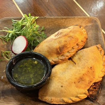 Piedra Santa - Empanada Duo served with chimichurri - Steakhouses Near Me - San Diego, California Piedra Santa - Empanada Duo served with chimichurri - Steakhouses Near Me - San Diego, California