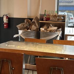 Chipotle Mexican Grill - Over flowing trash and filthy tables.