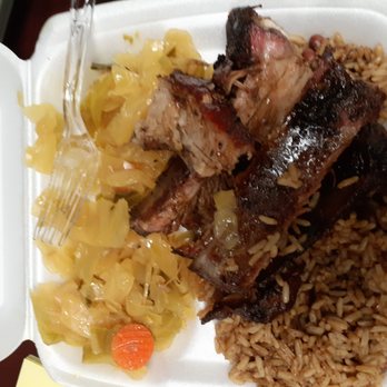 Caribbean Castle - a white styrofoam container with meat and rice - Caribbean Near Me - Hampton, Virginia