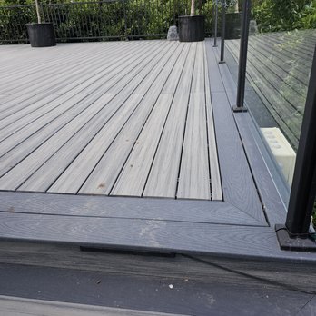 Sierra Revolution Landscaping - a deck with glass railings - Landscaping Near Me Sierra Revolution Landscaping - a deck with glass railings - Landscaping Near Me