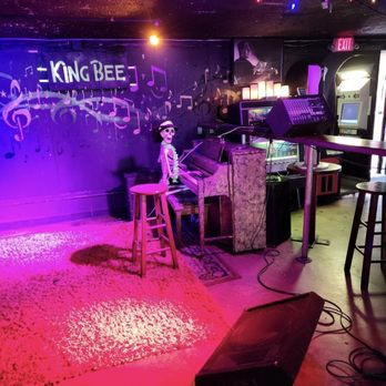 King Bee Lounge - Near the stage area, a lone skeleton playing the piano. - Bars Near Me - Austin, Texas King Bee Lounge - Near the stage area, a lone skeleton playing the piano. - Bars Near Me - Austin, Texas