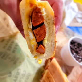 Cuban Coffee Queen - Inside the Egg, Cheese & Chorizo on Cuban bread - Breakfast sandwich - Coffee & Tea Near Me - Key West, Florida Cuban Coffee Queen - Inside the Egg, Cheese & Chorizo on Cuban bread - Breakfast sandwich - Coffee & Tea Near Me - Key West, Florida
