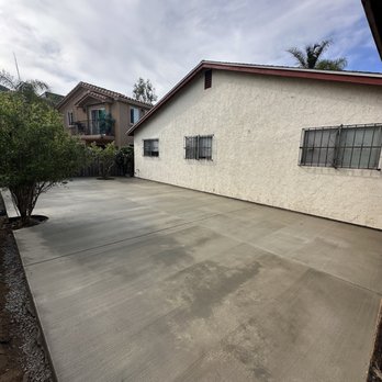 Manuel Landscape - New concrete in backyard - Landscaping Near Me