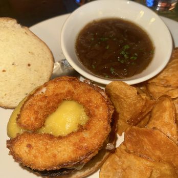 The James Joyce Irish Pub & Restaurant - Onion ring on French onion burger - Irish Pub Near Me - Baltimore, Maryland