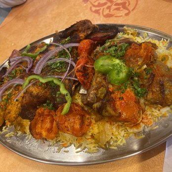Habibi Grill - Mendi lamb, grilled chicken, chicken kabab over mendi rice with grilled onions and tomatoes - Middle Eastern Near Me - Raleigh, North Carolina Habibi Grill - Mendi lamb, grilled chicken, chicken kabab over mendi rice with grilled onions and tomatoes - Middle Eastern Near Me - Raleigh, North Carolina