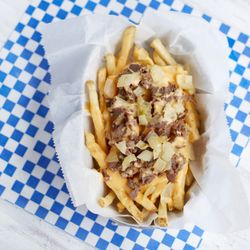 Quaker Steaks - Try our Phanatic Fries!  Hand cut, skin on french fries with cheese whiz and marinated rib eye steak.  Enough to share!