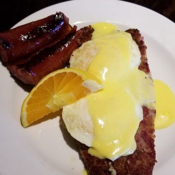 Famous Toastery - Corned beef hash with 2 eggs over medium w/ a side of smoked sausage. - Breakfast & Brunch Near Me - Concord, North Carolina