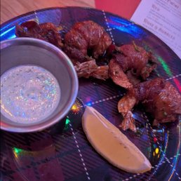 Over cooked shrimp with little plating effort Over cooked shrimp with little plating effort
