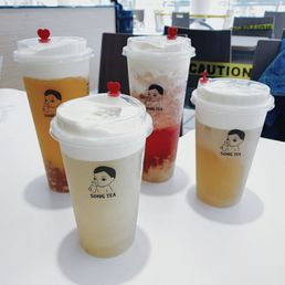 four season cheese tea, jasmine tieguanyin cheese tea, mango cheese tea with golden pearls & peach cheese