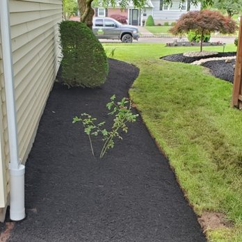 D&E Landscaping - a black mulch mulch bed in front of a house - Landscaping Near Me - Somerville, New Jersey