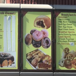A side view of the building with the menu posted on wall. It shares a parking lot with the EXXON station A side view of the building with the menu posted on wall. It shares a parking lot with the EXXON station