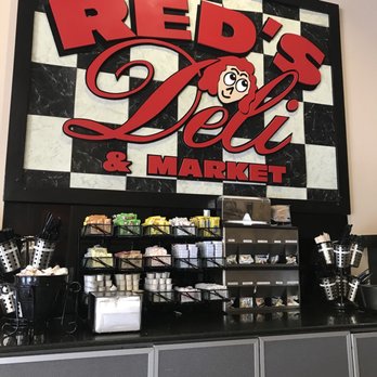 Reds Deli - a sign for a deli and market - Delis Near Me - Orlando, Florida