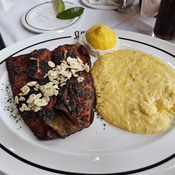 Superior's Steakhouse - Blackened trout amandine with side of cheesy grits - Steakhouses Near Me - Shreveport, Louisiana Superior's Steakhouse - Blackened trout amandine with side of cheesy grits - Steakhouses Near Me - Shreveport, Louisiana