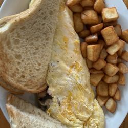 Ham and mushroom omelette with home fries and toast