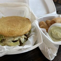 Arepas Milko - Fried arepa with pulled meat and tequeños