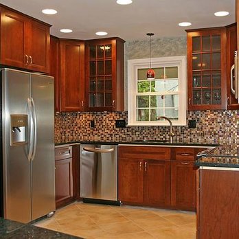 Gianni Durigon - a kitchen with stainless steel appliances - Flooring Near Me Gianni Durigon - a kitchen with stainless steel appliances - Flooring Near Me