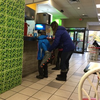Restaurant Lafleur - a woman and a child at a counter - Hot Dogs Near Me - Montreal, Quebec Restaurant Lafleur - a woman and a child at a counter - Hot Dogs Near Me - Montreal, Quebec