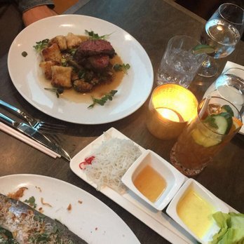 Loloan Lobby Bar - Main Plates: Baker Sapi Bagus (tenderloin medallions) on left, Cha Ca Thang Long (rainbow trout) on right - Asian Fusion Near Me - Waterloo, Ontario Loloan Lobby Bar - Main Plates: Baker Sapi Bagus (tenderloin medallions) on left, Cha Ca Thang Long (rainbow trout) on right - Asian Fusion Near Me - Waterloo, Ontario