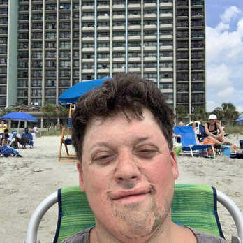 Compass Cove Resort - Where we stayed at in the background you can see the half solid balconies directly behind me. - Resorts Near Me - Myrtle Beach, South Carolina